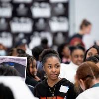 Girls of Color Summit previous event with the audience listening to a presentation